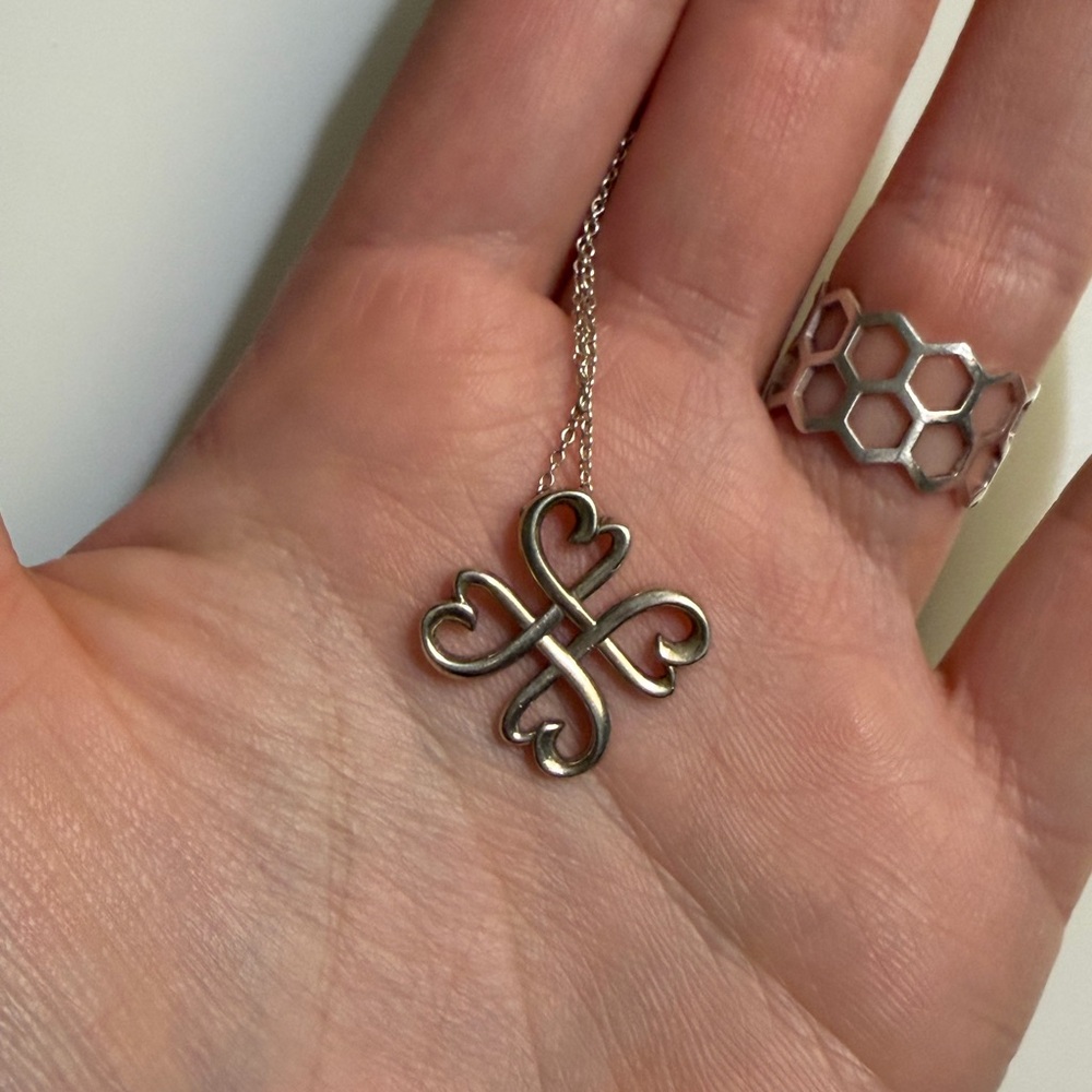 Elegant Silver Heart Knot Pendant